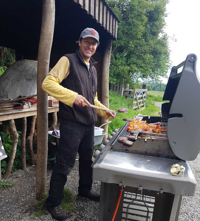 man at barbeque on Rock Farm Slane